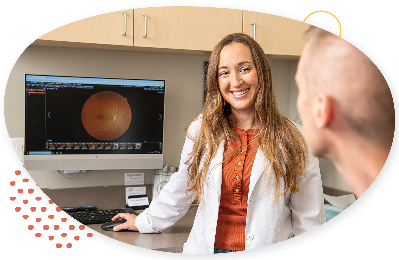 Woman smiling reviewing an image with a patient