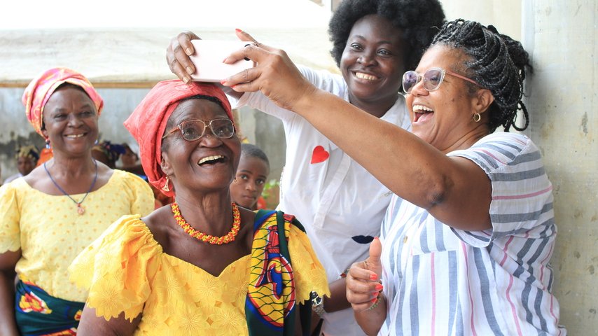 A group of women in Nigeria smiling with their new eyeglasses